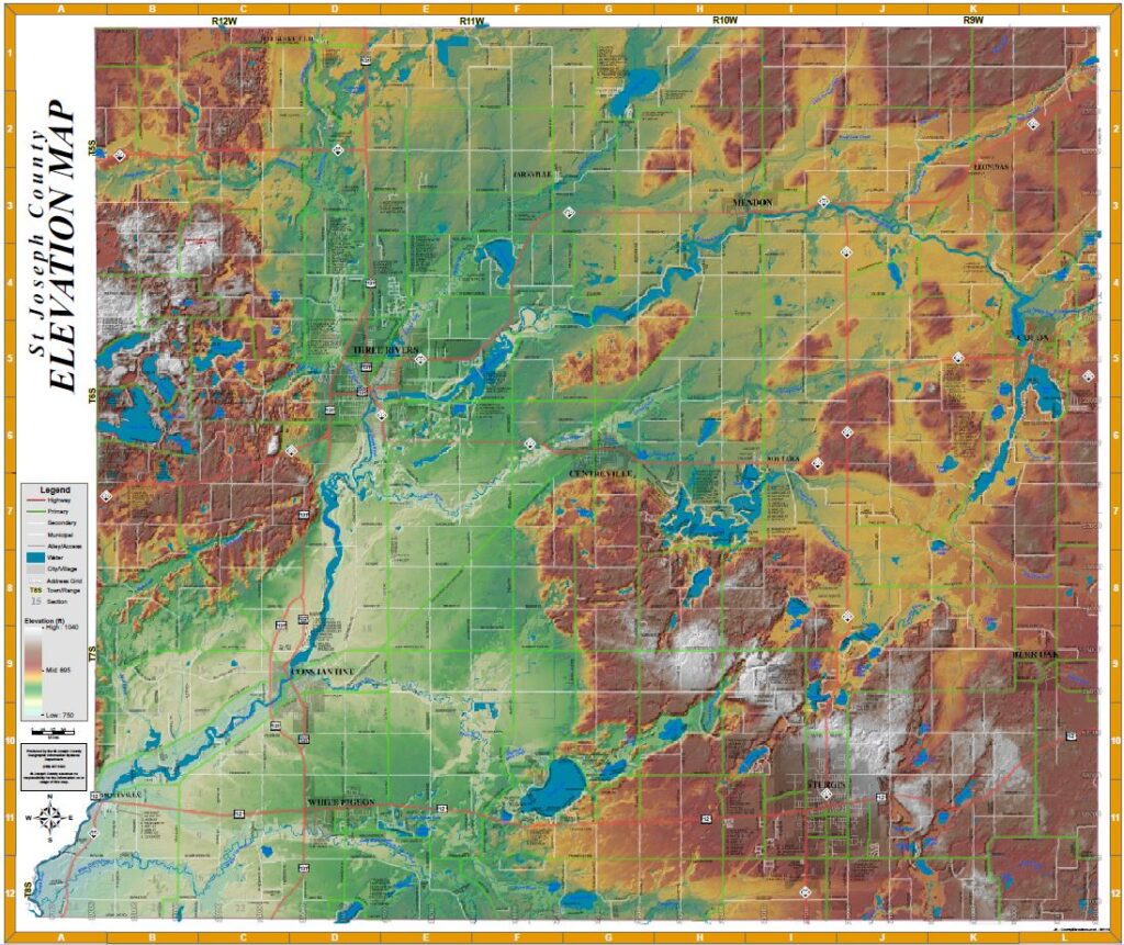 A topographic relief map of St. Joseph County using a color gradient to show elevation. Green represents low-lying river valleys (around 750 feet), while brown and white indicate high-elevation ridges and hills (up to 1,040 feet).
